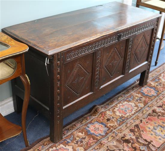 A 17th century oak coffer W.125cm